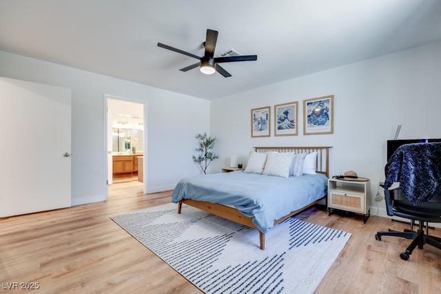 1926 Navarre Ln, Henderson, NV 89014 - bedroom with wood finished floors, ceiling fan, and connected bathroom