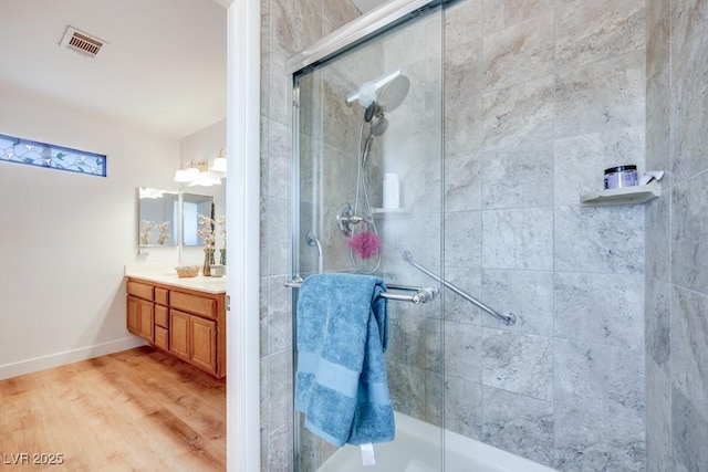 1926 Navarre Ln, Henderson, NV 89014 - bathroom with a tile shower, vanity, and wood finished floors