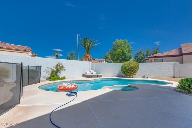 1926 Navarre Ln, Henderson, NV 89014 - view of swimming pool with a fenced backyard, a patio, and a pool with connected hot tub