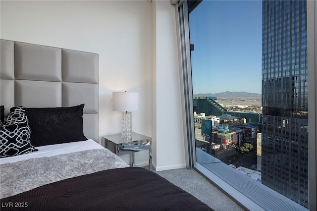 3722 Las Vegas Blvd Unit 2512E, Las Vegas, NV 89158 - bedroom with carpet flooring and a mountain view