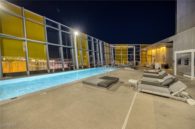 3722 Las Vegas Blvd Unit 2512E, Las Vegas, NV 89158 - pool at twilight with a community pool and a patio