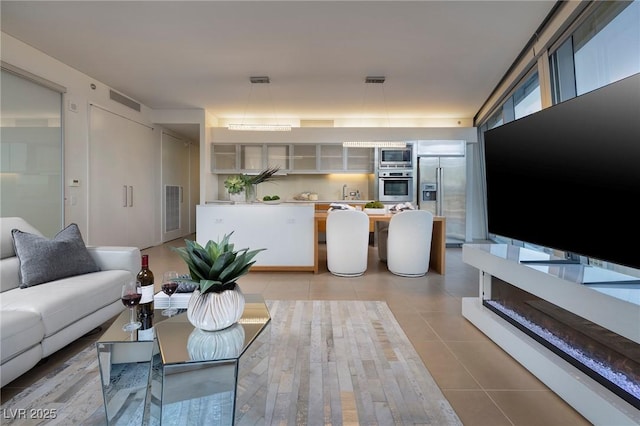 3722 Las Vegas Blvd Unit 2512E, Las Vegas, NV 89158 - living room featuring light tile patterned floors