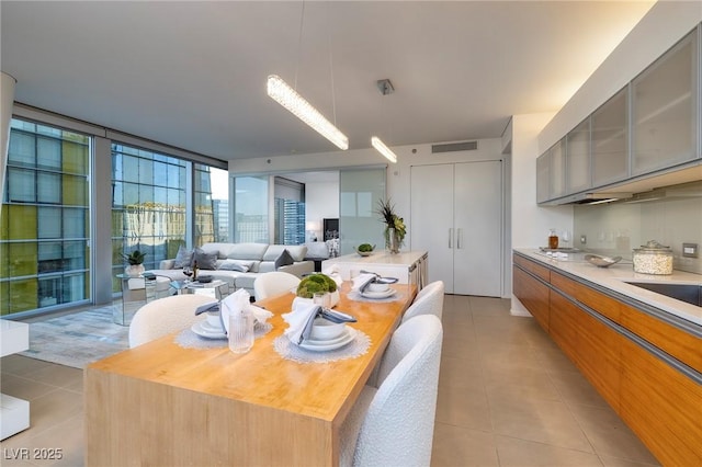 3722 Las Vegas Blvd Unit 2512E, Las Vegas, NV 89158 - dining area featuring light tile patterned flooring and a wall of windows