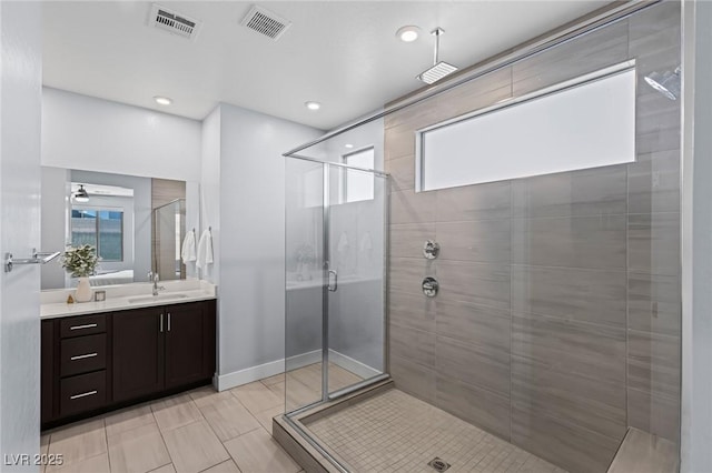 9785 Granite Mesa St, Las Vegas, NV 89141 - full bathroom with a stall shower, vanity, healthy amount of natural light, and a ceiling fan