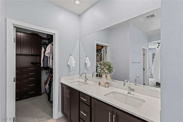 9785 Granite Mesa St, Las Vegas, NV 89141 - bathroom featuring double vanity and a spacious closet