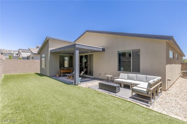 9785 Granite Mesa St, Las Vegas, NV 89141 - back of property featuring outdoor lounge area, stucco siding, a fenced backyard, and a patio