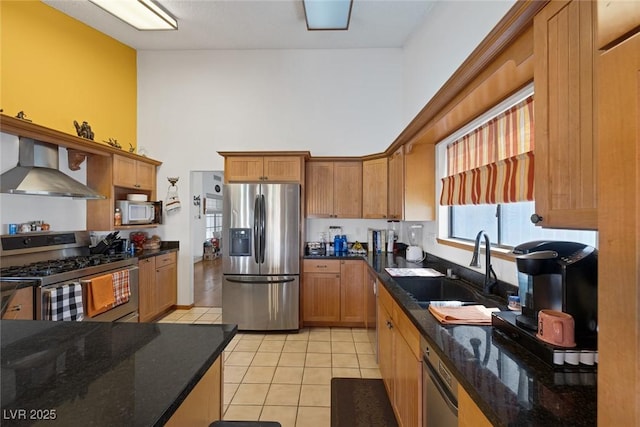 9100 Shelter Cove Ct, Las Vegas, NV 89117 - kitchen featuring stainless steel appliances, wall chimney exhaust hood, a high ceiling, light tile patterned floors, and dark stone counters