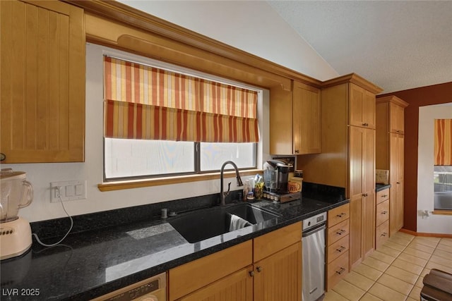 9100 Shelter Cove Ct, Las Vegas, NV 89117 - kitchen featuring light tile patterned floors, lofted ceiling, dark stone countertops, and dishwashing machine