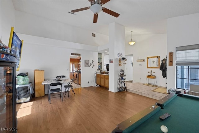 9100 Shelter Cove Ct, Las Vegas, NV 89117 - recreation room featuring a ceiling fan, wood finished floors, billiards, and lofted ceiling