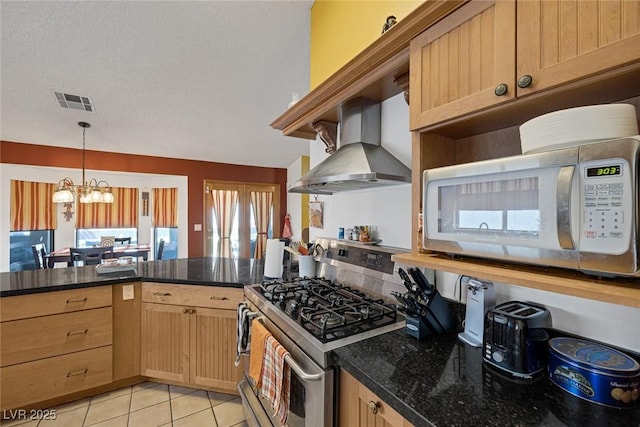 9100 Shelter Cove Ct, Las Vegas, NV 89117 - kitchen featuring gas range, wall chimney range hood, white microwave, and plenty of natural light