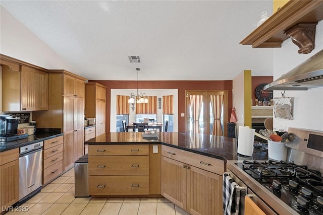 9100 Shelter Cove Ct, Las Vegas, NV 89117 - kitchen with gas range, pendant lighting, light tile patterned floors, a chandelier, and wall chimney range hood