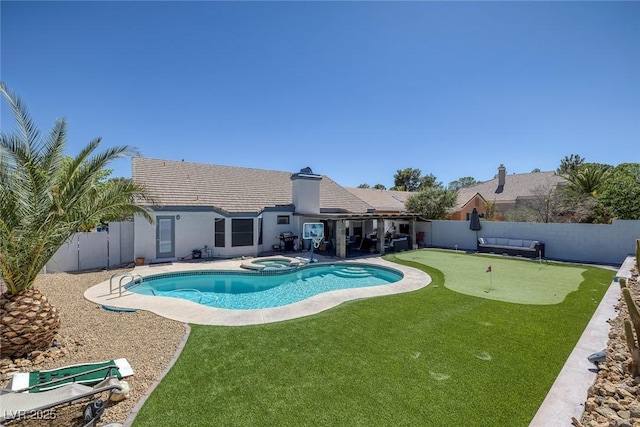 9100 Shelter Cove Ct, Las Vegas, NV 89117 - view of swimming pool featuring an area to practice putting, a fenced backyard, a patio, and a pool with connected hot tub