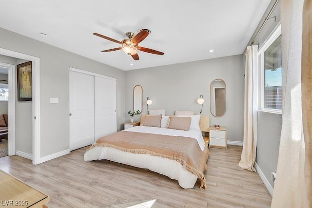 105 Shadow Ln, Las Vegas, NV 89106 - bedroom with multiple windows, light wood finished floors, a closet, and recessed lighting
