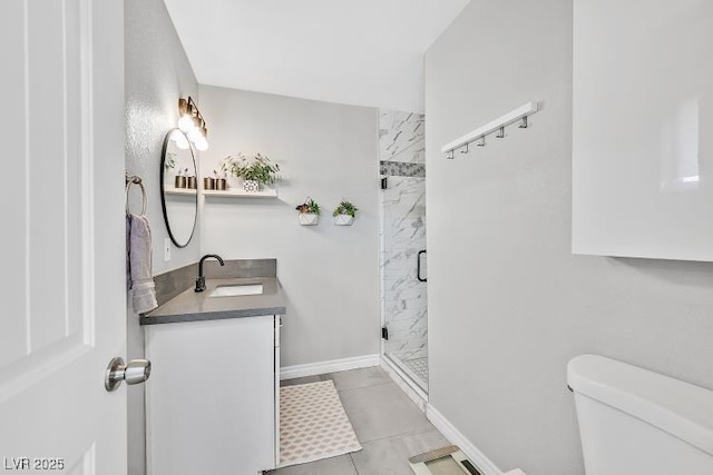 105 Shadow Ln, Las Vegas, NV 89106 - bathroom featuring a marble finish shower, vanity, and tile patterned floors