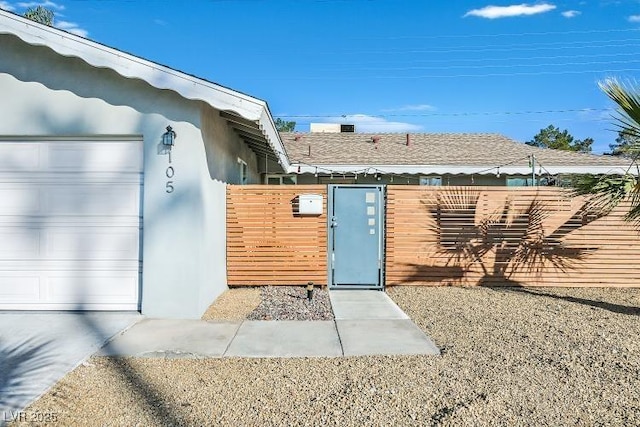105 Shadow Ln, Las Vegas, NV 89106 - entrance to property featuring a gate, a garage, and stucco siding