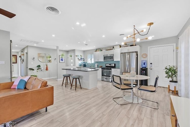 105 Shadow Ln, Las Vegas, NV 89106 - living room with light wood-style floors and recessed lighting
