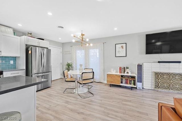 105 Shadow Ln, Las Vegas, NV 89106 - living area with a chandelier, light wood-type flooring, a fireplace, and recessed lighting