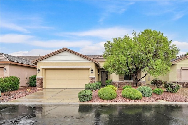 3720 Tack St, Las Vegas, NV 89122 - view of front of property featuring stone siding, a garage, stucco siding, and concrete driveway