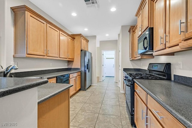 3720 Tack St, Las Vegas, NV 89122 - kitchen featuring black appliances, dark countertops, recessed lighting, and light tile patterned floors