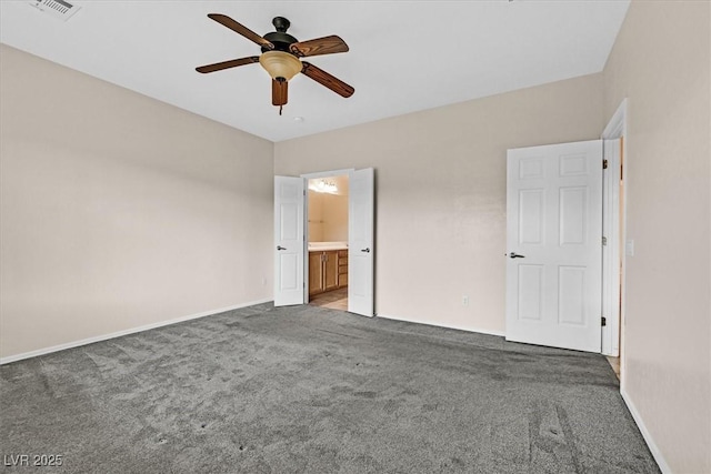 3720 Tack St, Las Vegas, NV 89122 - unfurnished bedroom with carpet floors, ensuite bathroom, and a ceiling fan
