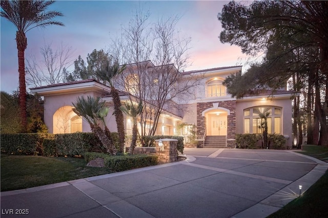 2041 Troon Dr, Henderson, NV 89074 - mediterranean / spanish-style home featuring stone siding and stucco siding