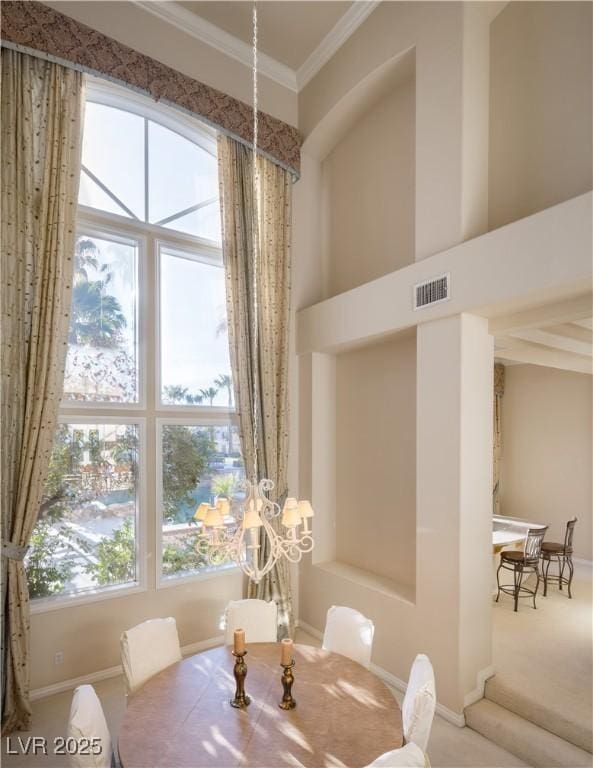2041 Troon Dr, Henderson, NV 89074 - carpeted dining space featuring ornamental molding and baseboards