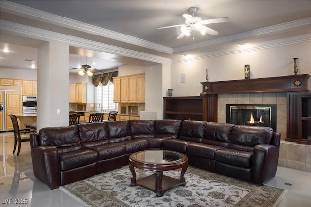 2041 Troon Dr, Henderson, NV 89074 - living area with ceiling fan, light tile patterned floors, crown molding, and a tiled fireplace