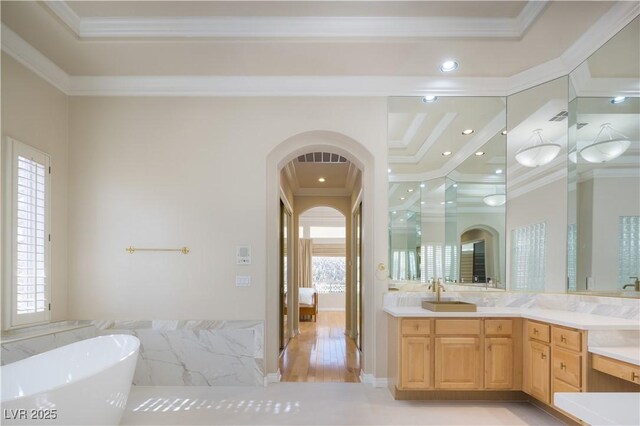 2041 Troon Dr, Henderson, NV 89074 - bathroom featuring ornamental molding, a freestanding bath, vanity, a shower stall, and recessed lighting