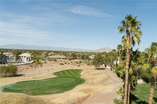 2041 Troon Dr, Henderson, NV 89074 - surrounding community with a putting green, golf course view, and a mountain view