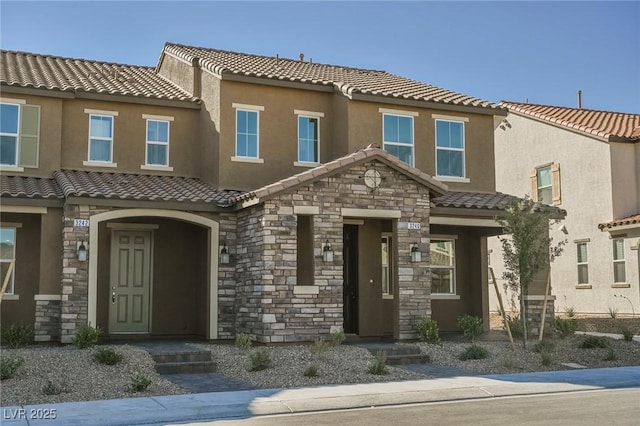 3240 Avernus Ave, Henderson, NV 89044 - view of property with a tile roof, stone siding, and stucco siding