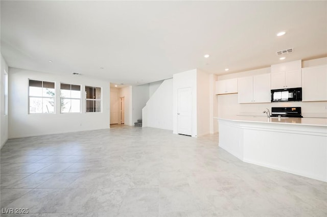 3240 Avernus Ave, Henderson, NV 89044 - unfurnished living room with stairway and recessed lighting