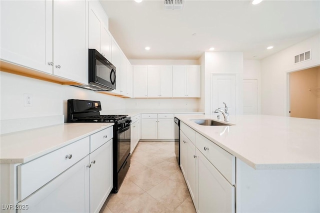 3240 Avernus Ave, Henderson, NV 89044 - kitchen featuring black appliances, white cabinetry, light countertops, recessed lighting, and a kitchen island with sink