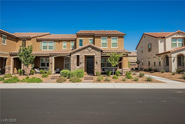 3240 Avernus Ave, Henderson, NV 89044 - view of front of property featuring covered porch, stucco siding, stone siding, and a tiled roof