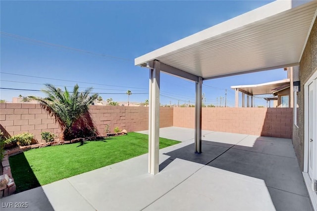 6346 Azurelyn Ave, Las Vegas, NV 89122 - fenced backyard featuring a patio area