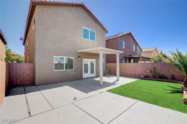 6346 Azurelyn Ave, Las Vegas, NV 89122 - back of house with a fenced backyard, french doors, stucco siding, and a patio area