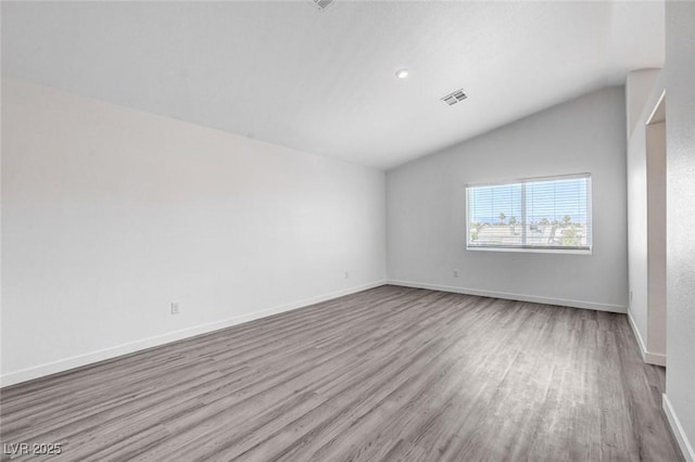 6346 Azurelyn Ave, Las Vegas, NV 89122 - spare room featuring lofted ceiling, wood finished floors, and recessed lighting