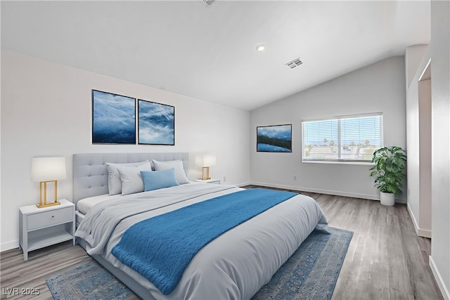 6346 Azurelyn Ave, Las Vegas, NV 89122 - bedroom featuring light wood finished floors and vaulted ceiling