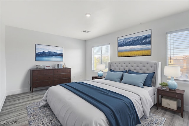 6346 Azurelyn Ave, Las Vegas, NV 89122 - bedroom with light wood-style flooring and baseboards