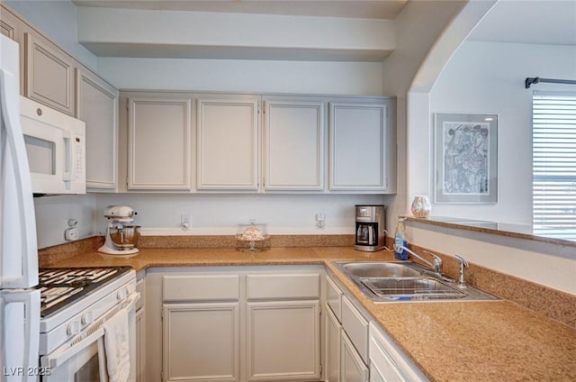 9975 Peace Way Unit 1024, Las Vegas, NV 89147 - kitchen featuring white appliances, plenty of natural light, and light countertops