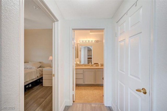 9975 Peace Way Unit 1024, Las Vegas, NV 89147 - hall with a sink and light wood-style floors