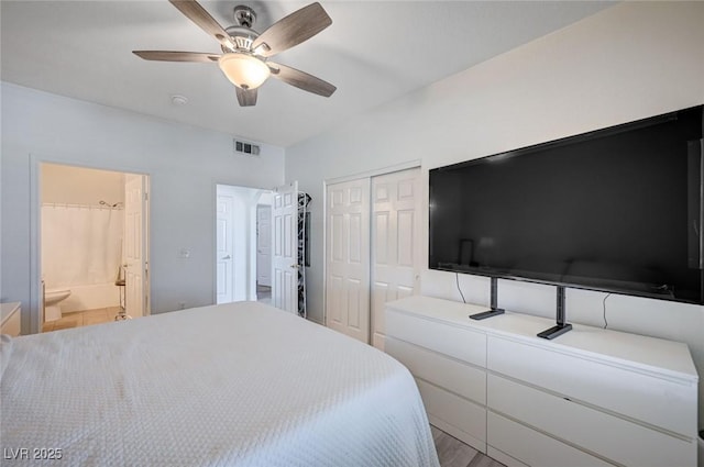 9975 Peace Way Unit 1024, Las Vegas, NV 89147 - bedroom with ensuite bathroom, ceiling fan, a closet, and wood finished floors