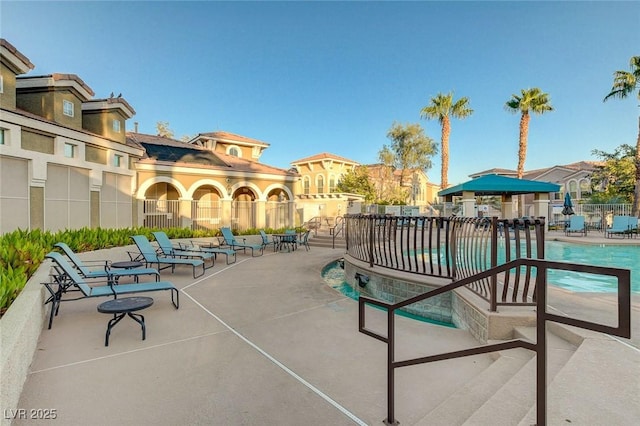 9975 Peace Way Unit 1024, Las Vegas, NV 89147 - community pool with a patio area