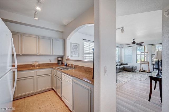 9975 Peace Way Unit 1024, Las Vegas, NV 89147 - kitchen with white appliances, arched walkways, a ceiling fan, open floor plan, and rail lighting