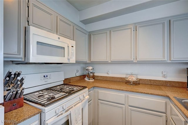 9975 Peace Way Unit 1024, Las Vegas, NV 89147 - kitchen with white appliances and light countertops