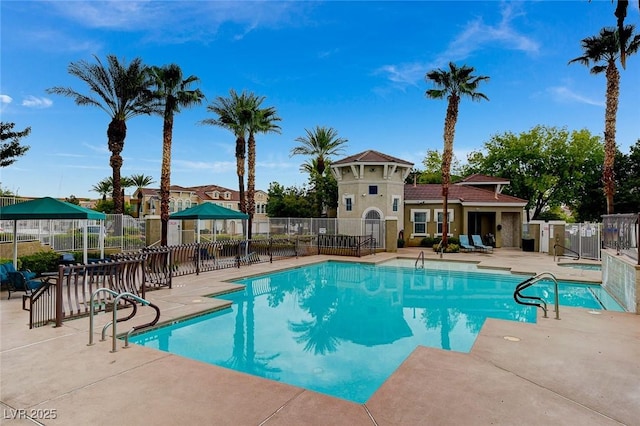 9975 Peace Way Unit 1024, Las Vegas, NV 89147 - community pool featuring a patio area