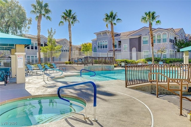 9975 Peace Way Unit 1024, Las Vegas, NV 89147 - community pool featuring a residential view, a patio, and a community hot tub