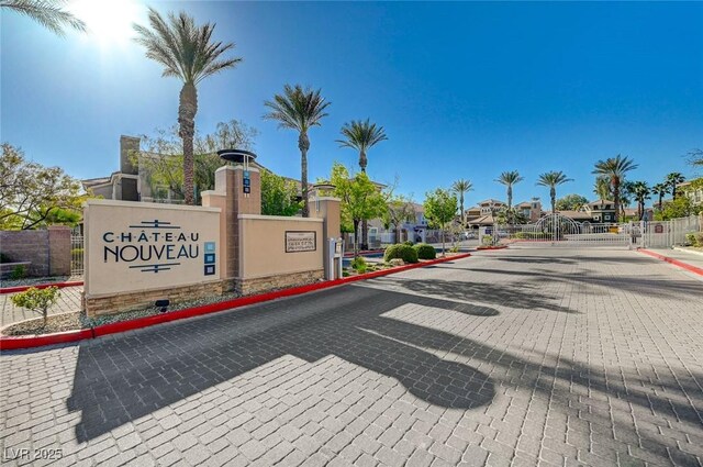 9975 Peace Way Unit 1024, Las Vegas, NV 89147 - view of road with curbs, a gated entry, and a residential view