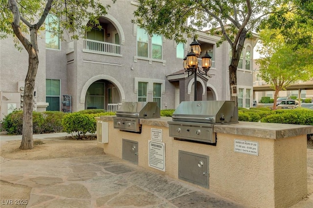 9975 Peace Way Unit 1024, Las Vegas, NV 89147 - view of patio featuring an outdoor kitchen