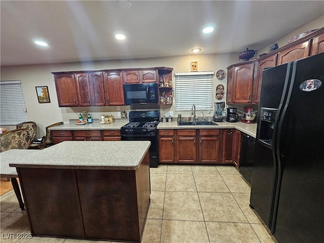 kitchen with black appliances, light countertops, light tile patterned floors, a center island, and recessed lighting