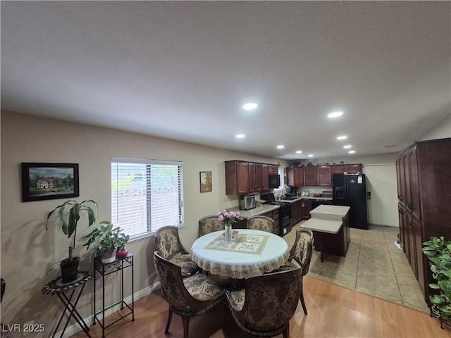 dining room featuring recessed lighting